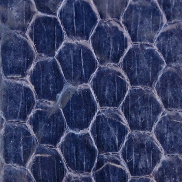 The Blue Snake Skin Handmade Leather Watch Strap features a close-up texture with a hexagonal pattern like a honeycomb, reminiscent of a vintage watch face. Its dark blue or purple surface glimmers with a shiny, reflective quality.