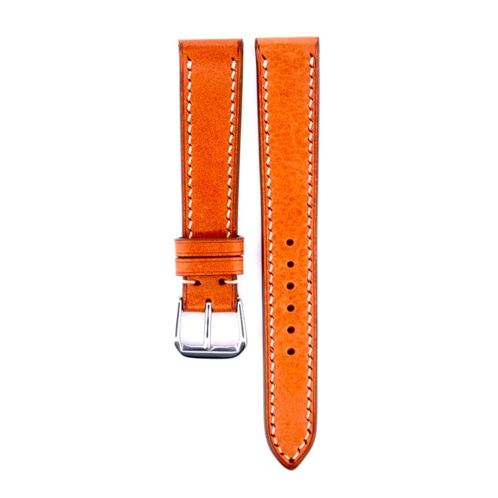 The Light Brown Buttero Leather Handmade Watch Strap features white stitching and a silver buckle. It comes in two sections: one with the buckle and another with multiple holes for adjustment, showcasing its craftsmanship against a crisp white background.