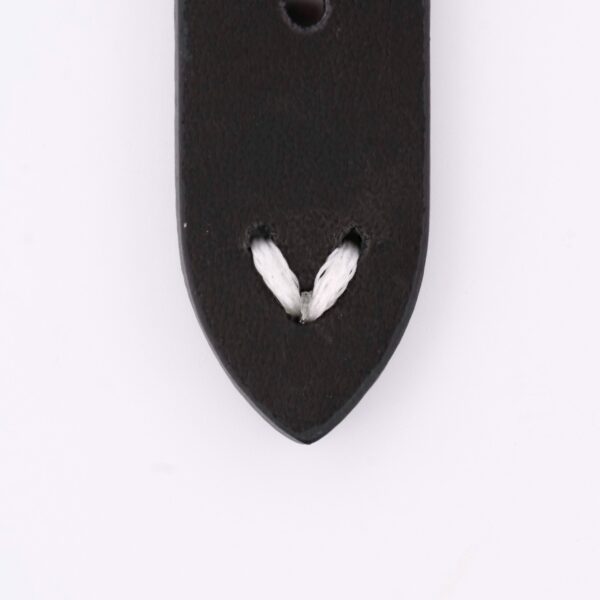 Close-up of a dark-colored Vintage Calf Leather Watch Strap Single End Stitch, featuring two small slits with a white cord looped through. Set against a plain white background, it exudes timeless elegance.