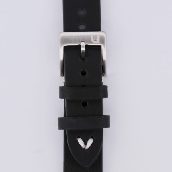 Close-up of a black Vintage Calf Leather Watch Strap Single End Stitch, featuring a silver buckle. Its white stitching enhances its classic appeal, while several adjustment holes and two loops efficiently manage excess strap length.