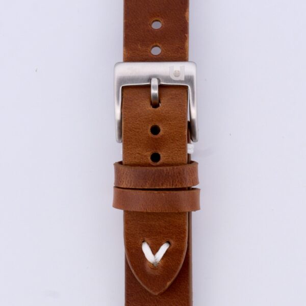 Close-up of the Vintage Calf Leather Watch Strap Single End Stitch, featuring a silver buckle, multiple adjustment holes, and a white stitch accent. The smooth brown leather showcases natural texture and color variations, enhancing its timeless appeal.