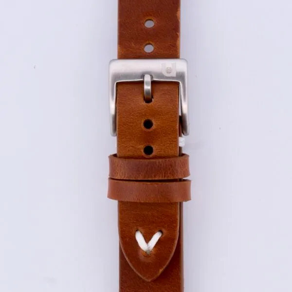 Close-up of the Vintage Calf Leather Watch Strap Single End Stitch, featuring a silver buckle, multiple adjustment holes, and a white stitch accent. The smooth brown leather showcases natural texture and color variations, enhancing its timeless appeal.
