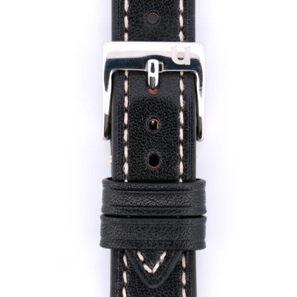 The Simple Stitch Classic Leather Watch Strap, crafted in black leather with beige stitching, exudes vintage charm. Its silver buckle showcases a small logo, adding timeless elegance.