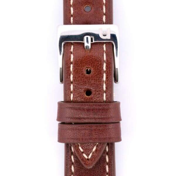 Close-up of the Simple Stitch Classic Leather Watch Strap in brown leather, featuring white stitching. It includes a silver buckle with a branded logo and multiple holes for sizing adjustments.
