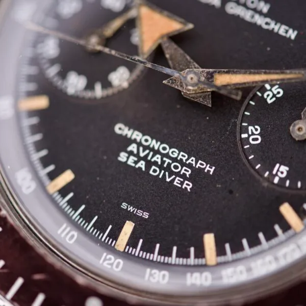 Close-up of a Nivada Grenchen Aviator Sea Diver Chronograph 1st Gen watch face, highlighting its vintage hands and detailed markings.