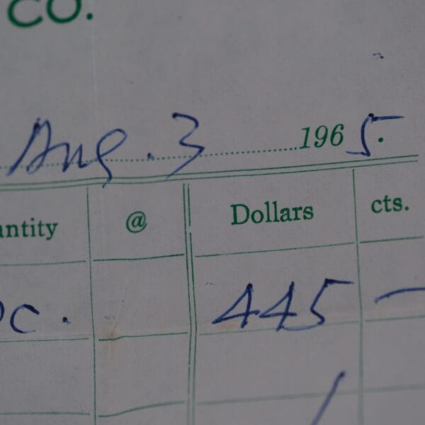A close-up of a dated form from August 3, 1965, shows 445 under the Dollars column within carefully detailed entries for Quantity, Dollars, and Cents—a timeless record like an Omega Seamaster Deville Automatic For Japanese Market watch in its precision.