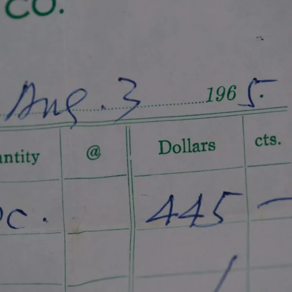 A close-up of a dated form from August 3, 1965, shows 445 under the Dollars column within carefully detailed entries for Quantity, Dollars, and Cents—a timeless record like an Omega Seamaster Deville Automatic For Japanese Market watch in its precision.