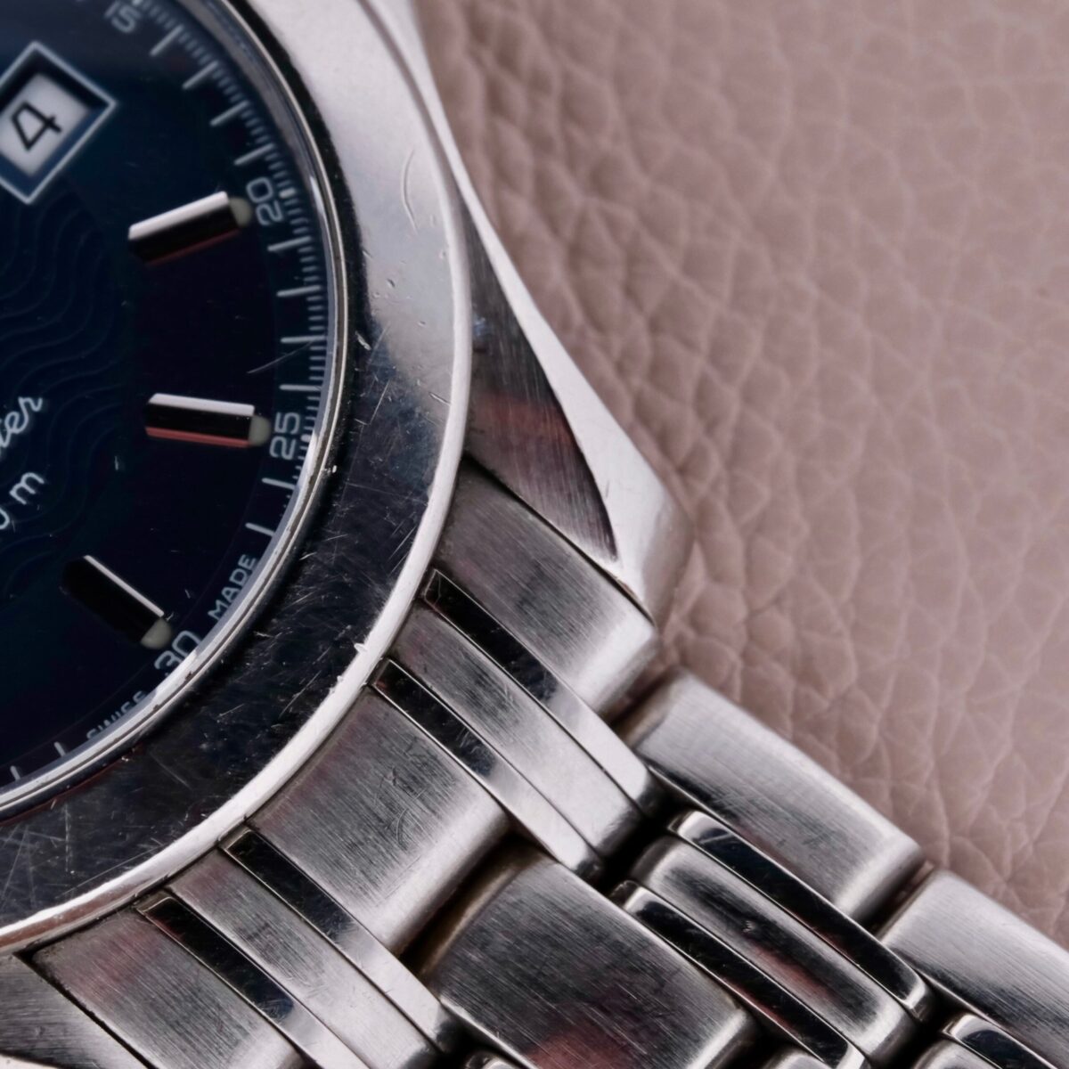 The Omega Seamaster 120M Blue Ref. 2511.81 is a distinguished Swiss-made timepiece from the 1990s, showcasing Omega's craftsmanship. It features a 36mm stainless steel case with a striking blue dial, gold-tone hands, and hour markers for optimal readability. The watch includes a central seconds hand, date function, and hack second feature for precise time-setting. Powered by a quartz movement, it ensures accurate timekeeping. The 18mm stainless steel bracelet offers comfort and durability. Water-resistant up to 120 meters, it is suitable for aquatic activities. The blend of silver, gold, and blue elements makes it a versatile and elegant accessory.