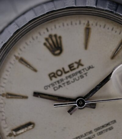 The Rolex Oyster Perpetual Datejust Ref 6605 is a vintage Swiss watch from the 1950s, featuring a 36mm stainless steel case and an Oyster steel bracelet. It is powered by the automatic Cal. 1066 movement and includes a central seconds hand and a date function. The watch has a white dial and a 20mm lug width.