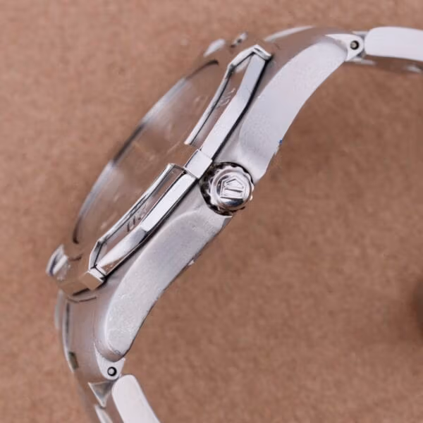 TAG Heuer Professional Dive ref WN1110-0 side profile showing signed shield-logo crown at 3 o'clock, polished case sides and integrated bracelet