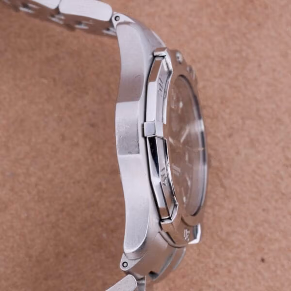 Opposite side profile of TAG Heuer Professional Dive WN1110-0, polished case flank without crown, brushed bracelet with case shoulder detail