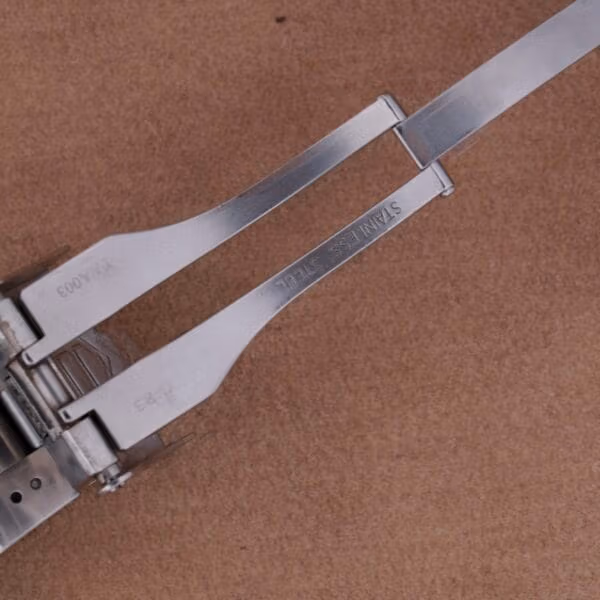 Underside of TAG Heuer Professional Dive WN1110-0 stainless steel bracelet showing the folding clasp arms and STAINLESS STEEL stamping