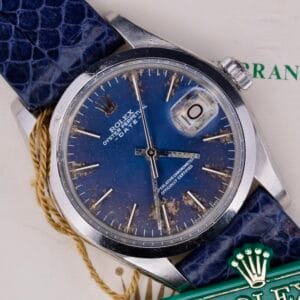 Close-up of a Rolex Oyster Perpetual Date 1500 with a blue dial and blue leather strap.
