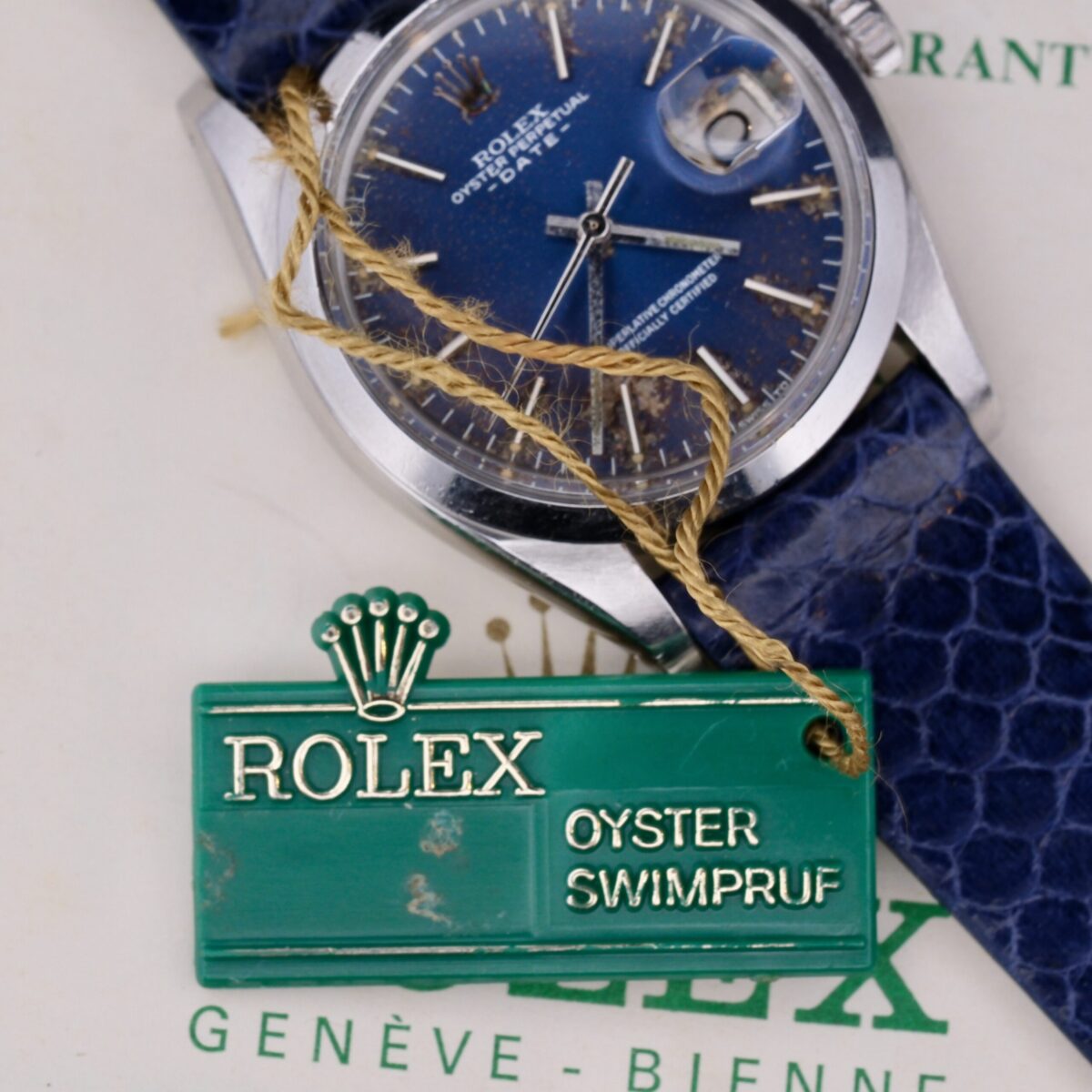 Introducing the Rolex Oyster Perpetual Date Ref 1500 Blue Dial, a Swiss-made masterpiece from the 1970s. This iconic timepiece features a 34mm stainless steel case, a striking blue dial with silver-tone markers, and an automatic movement. It includes a central seconds hand, date function, chronometer certification, hack second feature, and luminescent markers. Paired with an aftermarket leather strap, it offers a 19mm lug width for a comfortable fit. Complete with its original box, outer box, warranty, and manual papers, this watch epitomizes Rolex's enduring excellence and timeless appeal.