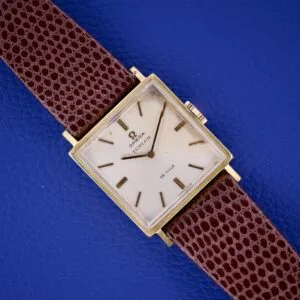 Omega Deville 111.071 Turler Dial Square Case wristwatch with a brown leather strap, displayed on a blue textured background.