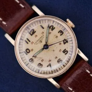 Longines Military 24 Hour Dial 12L wristwatch with a brown leather strap and an aged cream dial, showcased on a blue background.
