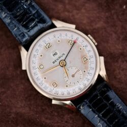 The Benrus Day/Date Pointer features a black leather band and gold numerals on a brown textured dial—an ideal vintage wristwatch for collectors seeking timeless style.