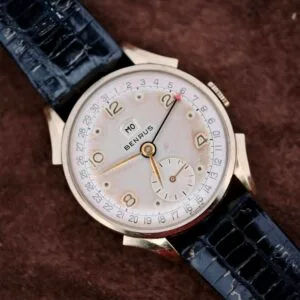 The Benrus Day/Date Pointer features a black leather band and gold numerals on a brown textured dial—an ideal vintage wristwatch for collectors seeking timeless style.