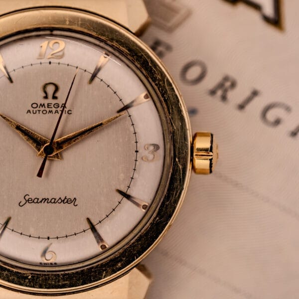 Close-up of the Omega Seamaster Automatic Ref. 14350-2 Bull Horn Lugs, featuring an elegant gold bezel and displaying the time at approximately 10:10.