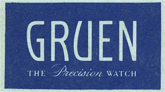 Blue rectangular label with the word GRUEN in large white letters. Below, in smaller white text, it reads THE Precision WATCH.