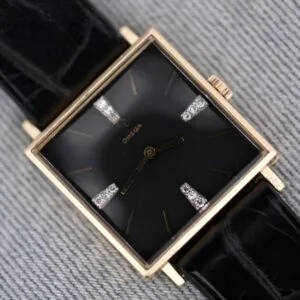 Omega 14K Square Case Diamond Markers wristwatch featuring a black face with gold details, diamond markers, and a black leather strap.