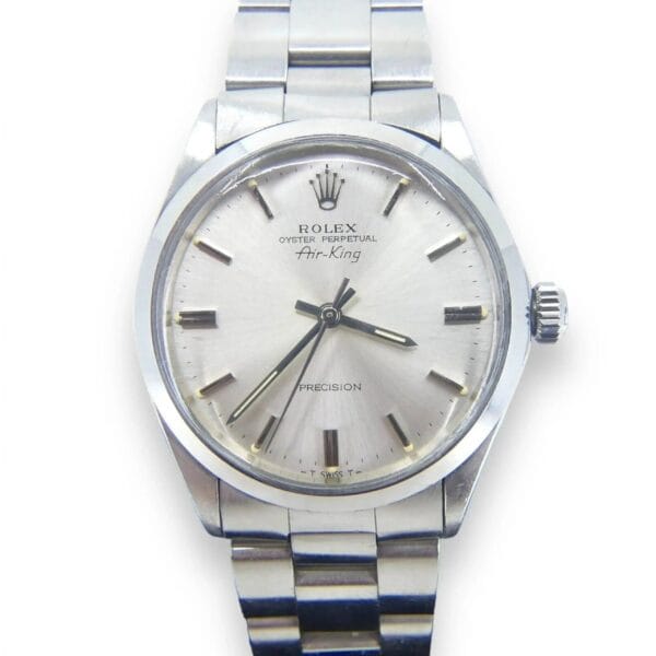 A Rolex Air King Precision 5500 mens watch featuring a silver dial with metal link band, white face, and silver hour markers and hands. Rolex Oyster Perpetual Air-King and Precision are visible on the dial, with a crown positioned on the right side.