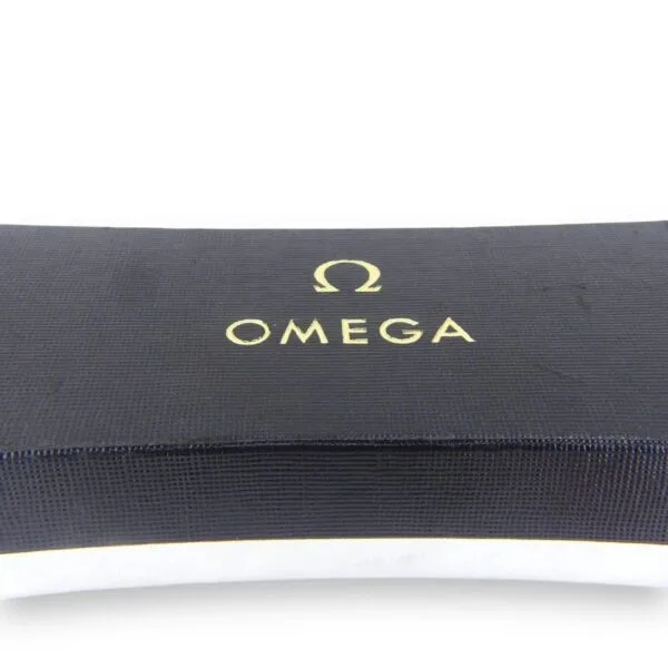 A close-up image of the Vintage Omega Continental Can box shows the gold-printed Omega logo and brand name on a textured, curved black surface with a smooth, clean appearance.