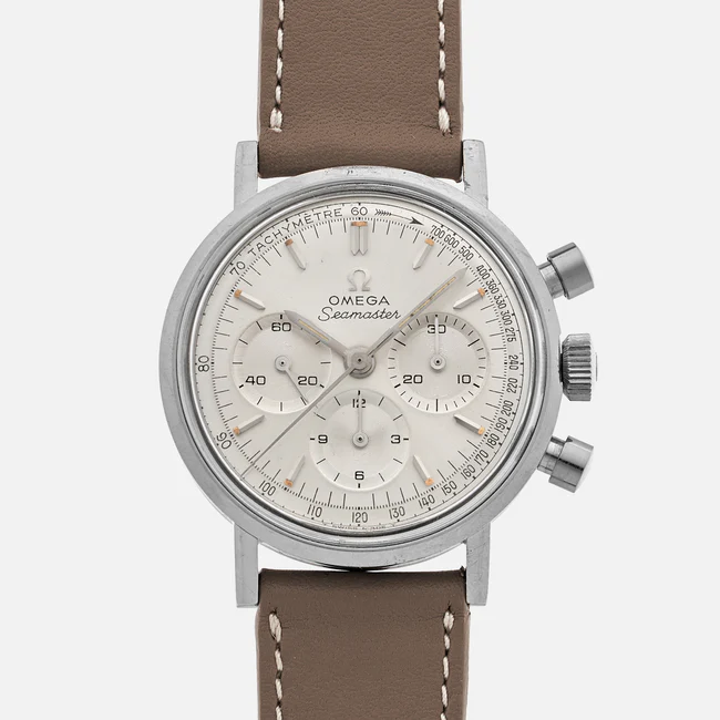 A silver Omega Seamaster 145.005 chronograph wristwatch with a white dial, three subdials, and a brown leather strap, displayed against a plain white background.