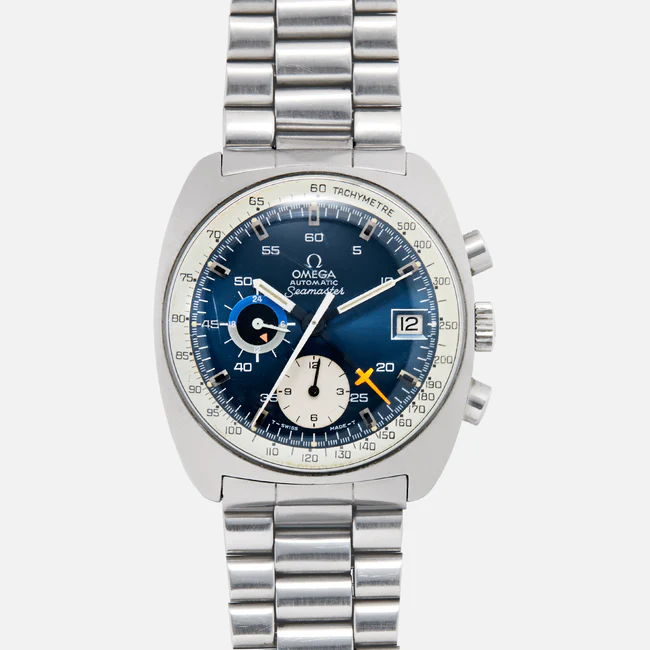 A stainless steel Omega Seamaster 176.007 chronograph wristwatch with a blue dial, three subdials, a date window at 3 o’clock, tachymeter scale, and a metal link bracelet.