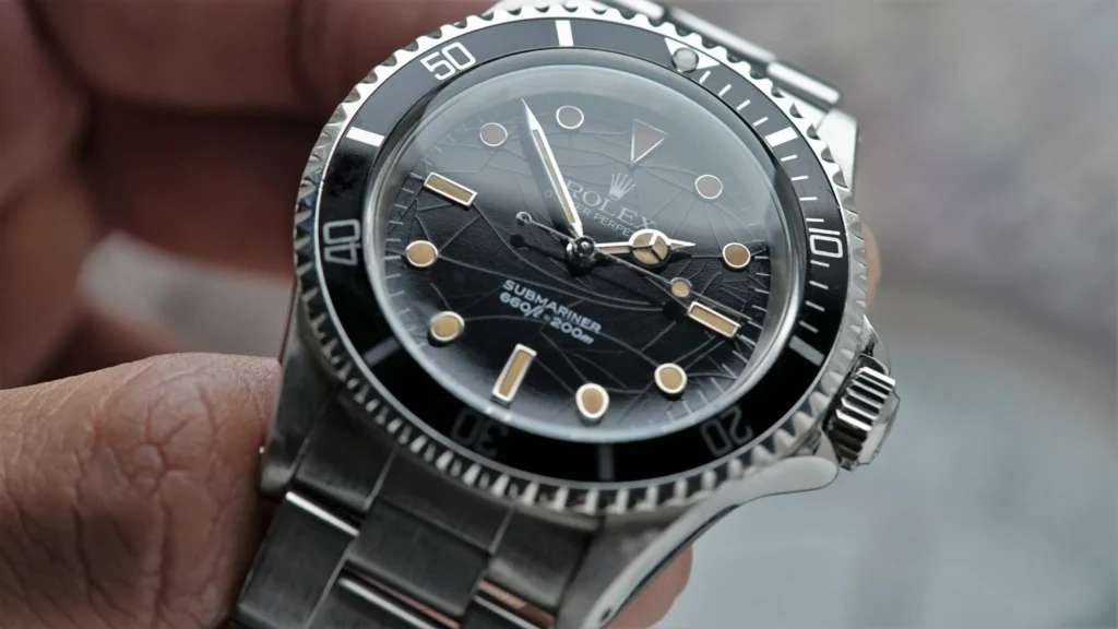 Rolex Submariner 5513 with spider dial patina — luminous markers showing subtle aging