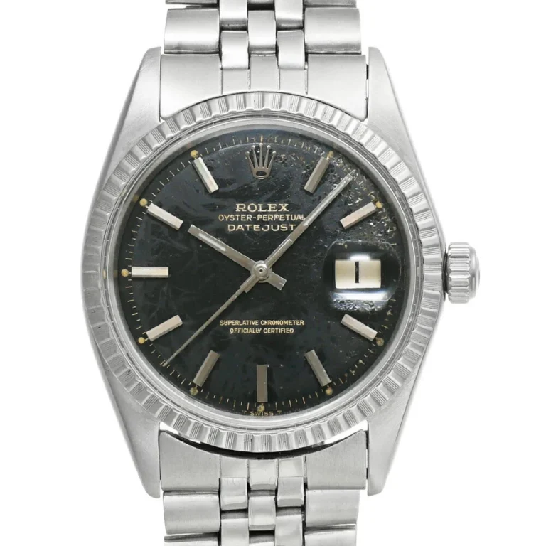 A stainless steel Rolex Datejust 1603 wristwatch with a black dial, silver hour markers, date window at 3 oclock, and Jubilee bracelet. The watch shows visible signs of wear on the dial.