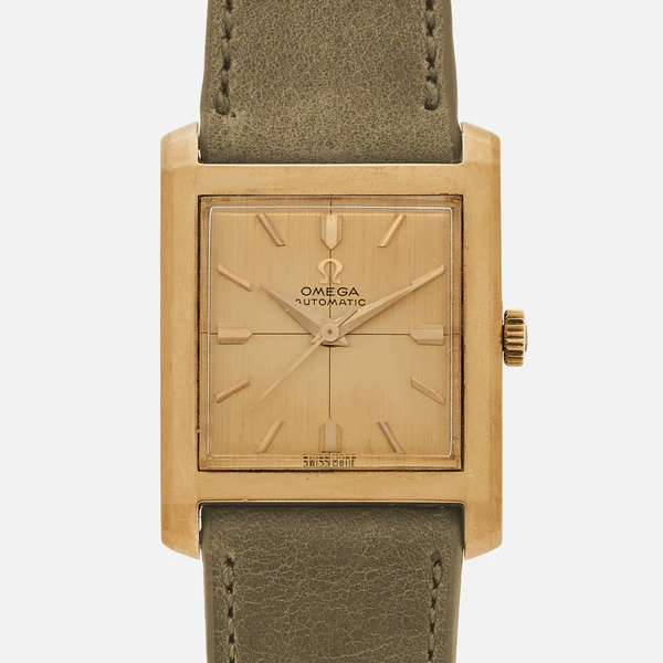 A square gold Omega Automatic wristwatch with a gold dial, minimal hour markers, and a greenish-brown leather strap. The crown is positioned on the right side of the case.