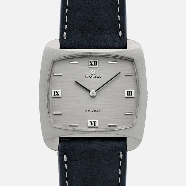 A square silver Omega De Ville 111.100 wristwatch with a black leather strap, Roman numerals at 3, 6, 9, and 12 o’clock, silver hour markers, and two silver hands on a brushed metal dial.