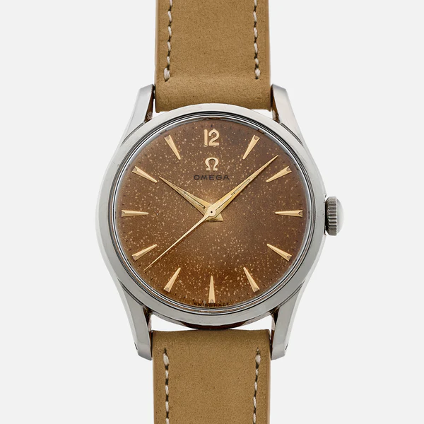 A vintage Omega wristwatch with a brown, slightly speckled dial, gold hour markers and hands, and a tan leather strap, displayed against a plain white background.