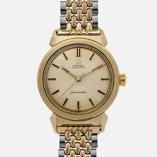 A gold and silver Omega Seamaster 14363 automatic wristwatch with a cream dial, gold hour markers, and a two-tone metal link band, shown against a plain white background.