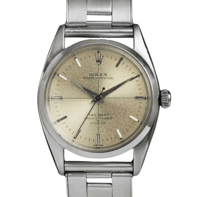 A vintage Rolex Oyster Perpetual Tru-Beat wristwatch with a metallic band and aged cream-colored dial.