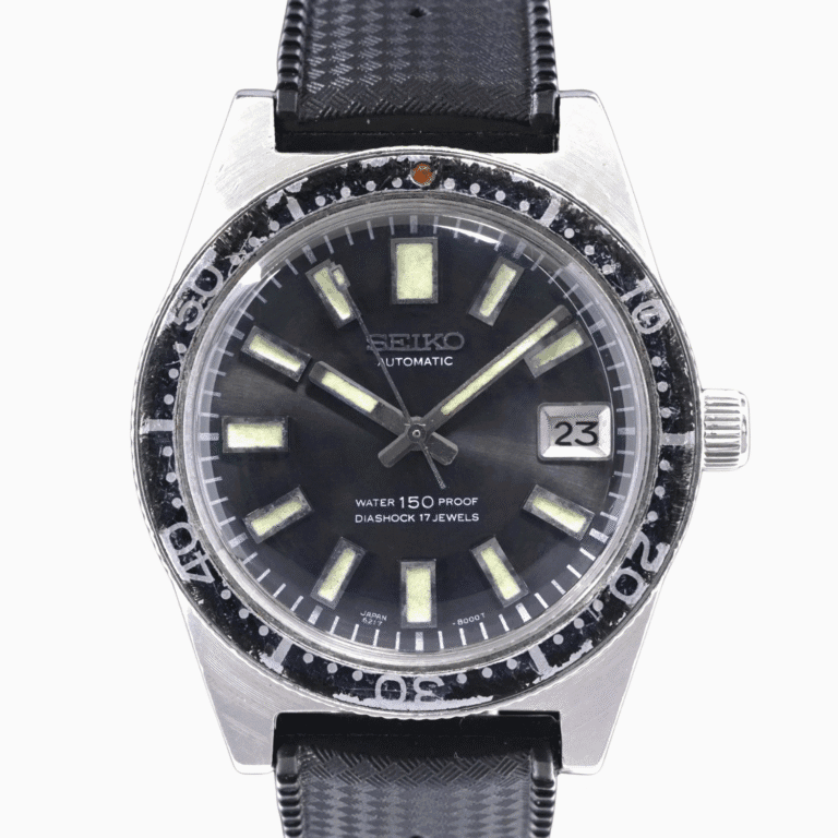 Vintage Seiko 62MAS automatic wristwatch, model 6217-8000, with black strap, luminous markers, and date display showing 23.