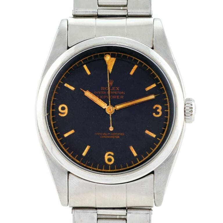 A vintage Rolex Explorer 6350 wristwatch featuring a black dial, silver case, and sleek silver metal band.