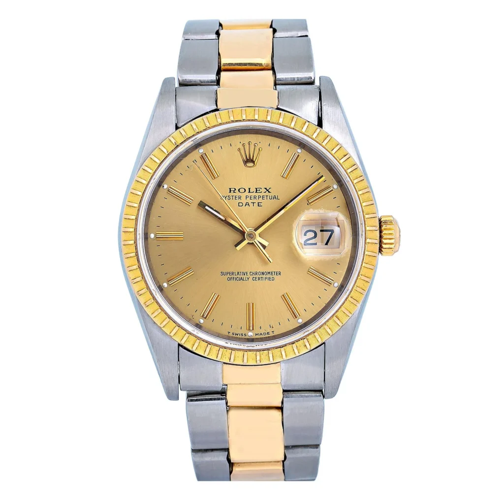 A Rolex Oyster Perpetual Date 15233 with a gold dial, gold bezel, and two-tone silver and gold metal band displaying the date.