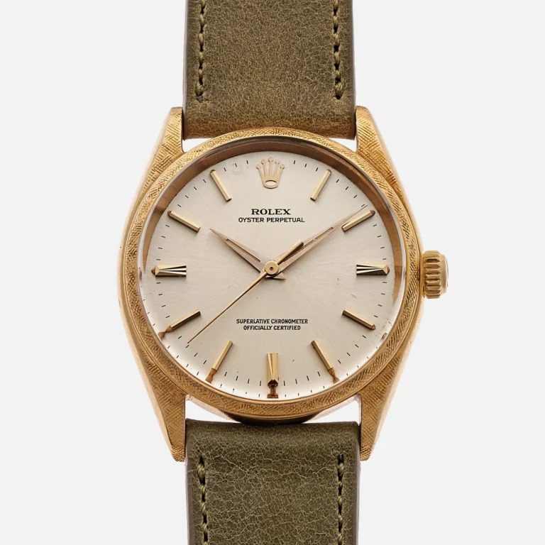Gold Rolex Oyster Perpetual 1022 wristwatch featuring a cream dial, gold markers, and an olive green leather strap.