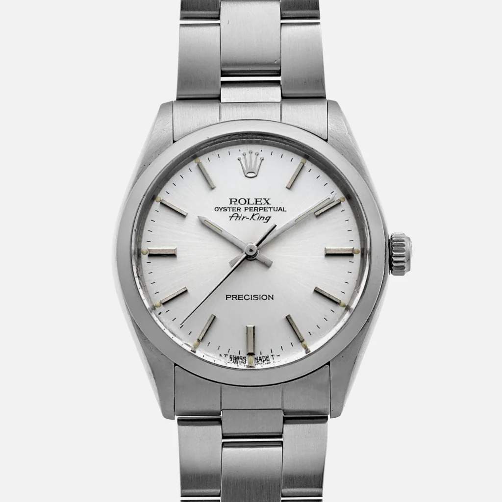 Silver Rolex Oyster Perpetual Air-King 5500 watch with a white dial and stainless steel bracelet, inspired by the classic style of the Rolex Explorer.