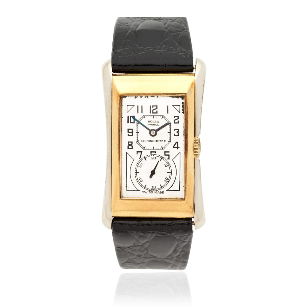 Rectangular gold vintage Rolex wristwatch with a white dial, black leather strap, and Art Deco-style numerals.