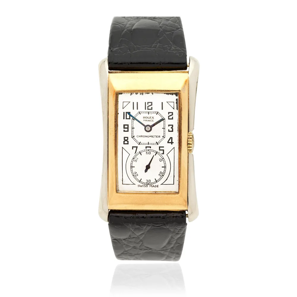 Rectangular gold vintage Rolex wristwatch with a white dial, black leather strap, and Art Deco-style numerals.