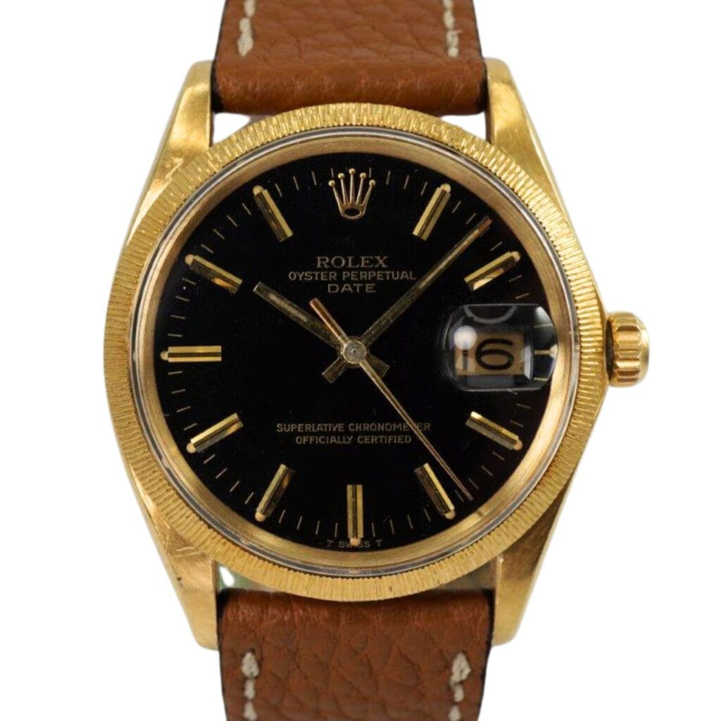 Gold Rolex Oyster Perpetual Date 1507 watch with a black dial and brown leather strap, showing the date as 16.