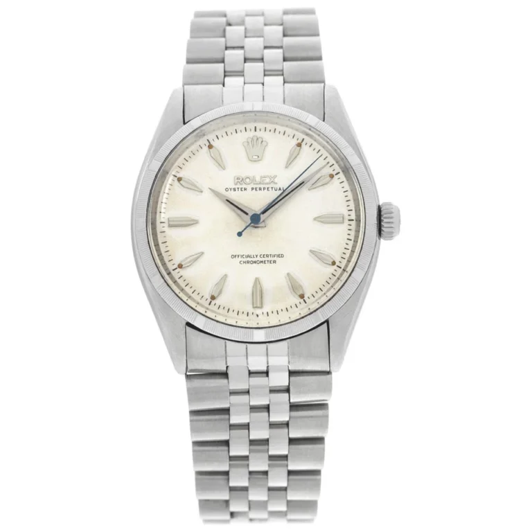 A silver Rolex Oyster Perpetual 6565 wristwatch with a cream dial and metal bracelet, featuring simple hour markers.