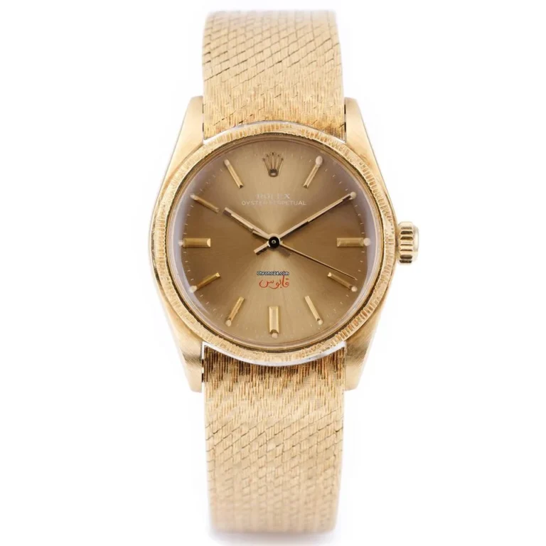 Gold wristwatch with a textured band and gold dial, featuring Arabic script above 6 o’clock—this elegant timepiece is inspired by the classic Rolex Oyster Perpetual 6744.