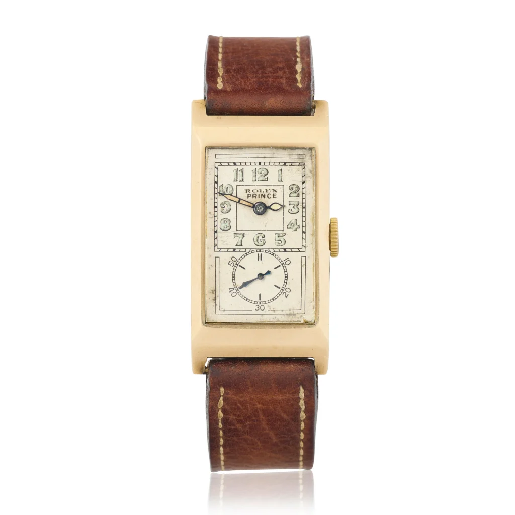 Vintage rectangular gold Rolex Prince wristwatch with a brown leather strap and a white dial displaying Arabic numerals—a true luxury watch for discerning collectors.
