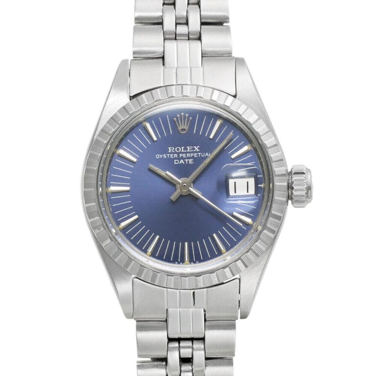 Silver Rolex Oyster Perpetual watch with a blue dial, Date 6924 window, and stainless steel bracelet.