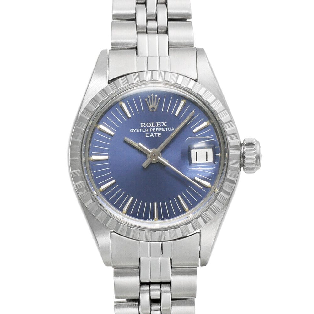 Silver Rolex Oyster Perpetual watch with a blue dial, Date 6924 window, and stainless steel bracelet.