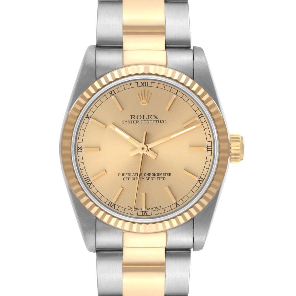 The Rolex Oyster Perpetual 67513 features a gold face and a two-tone silver and gold metal band, showcasing classic Rolex watch elegance.